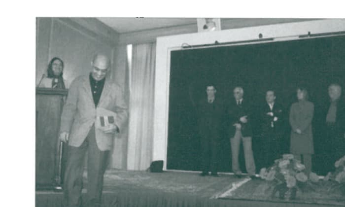 Farzad Rouzbeh receiving 4th place award