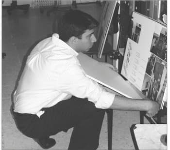 Juror Bahram Shokouhian reviewing submissions during the 6th Memar Award jury sessions