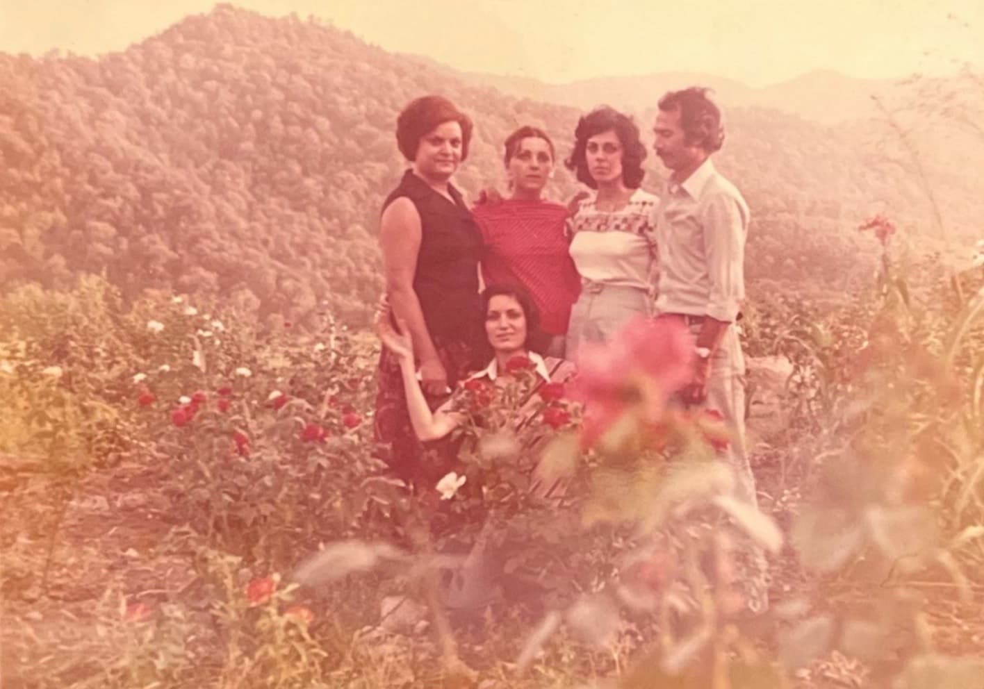 Soheila Beski with family in garden, pre-revolution